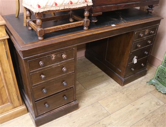 An early 20th century oak pedestal desk, W.143cm